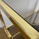 VINTAGE SHELF CONSOLE IN GOLD METAL AND SMOKED GLASS