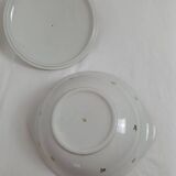 White earthenware soup tureen with a golden pattern.