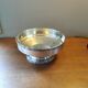 Art Deco coupe on a silver-plated metal stand.