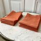 Lot de 8 serviettes de table en lin ajourées couleur terracotta