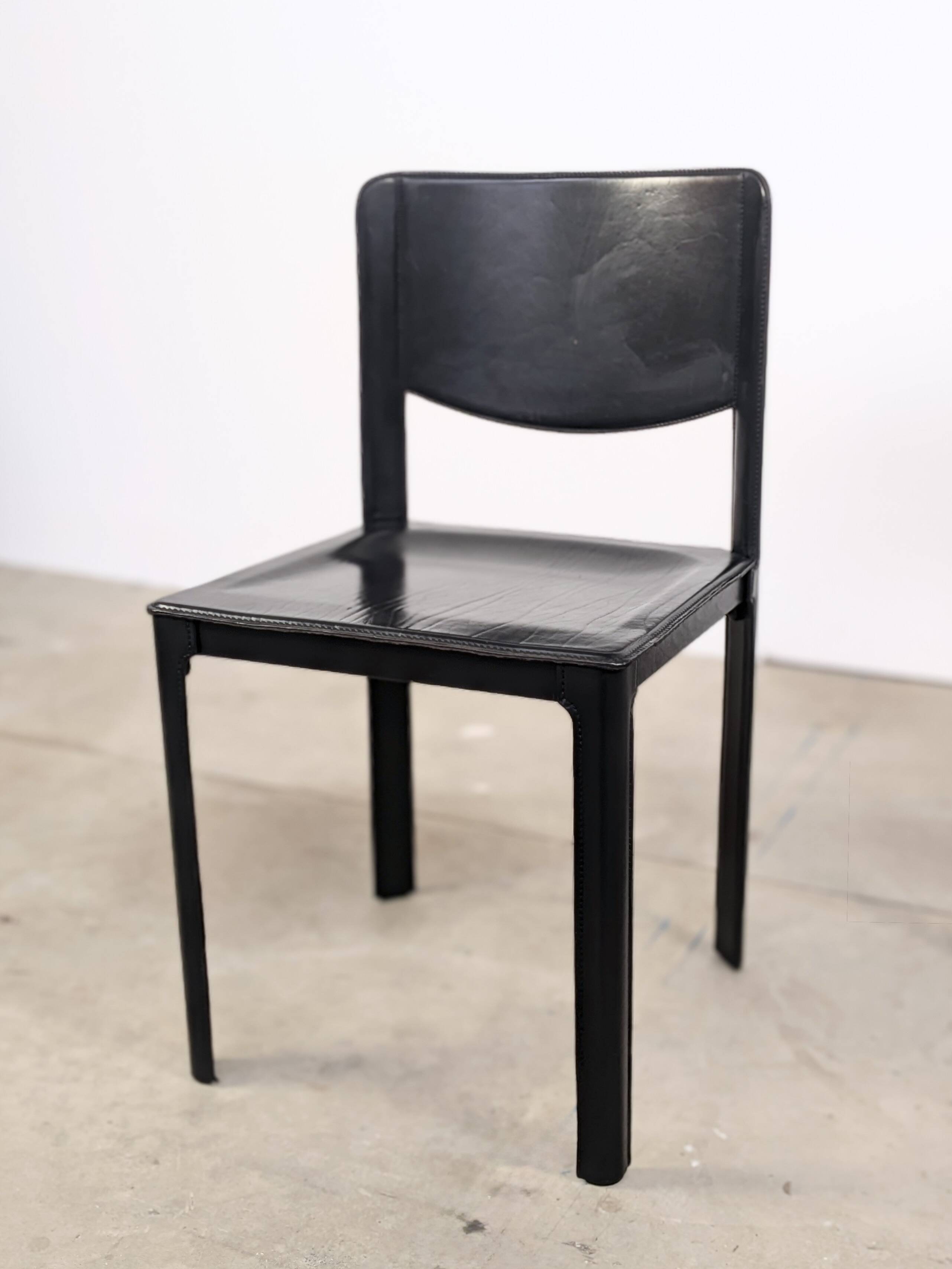 Pair of Matteo Grassi chairs in black saddle leather, 1980s.
