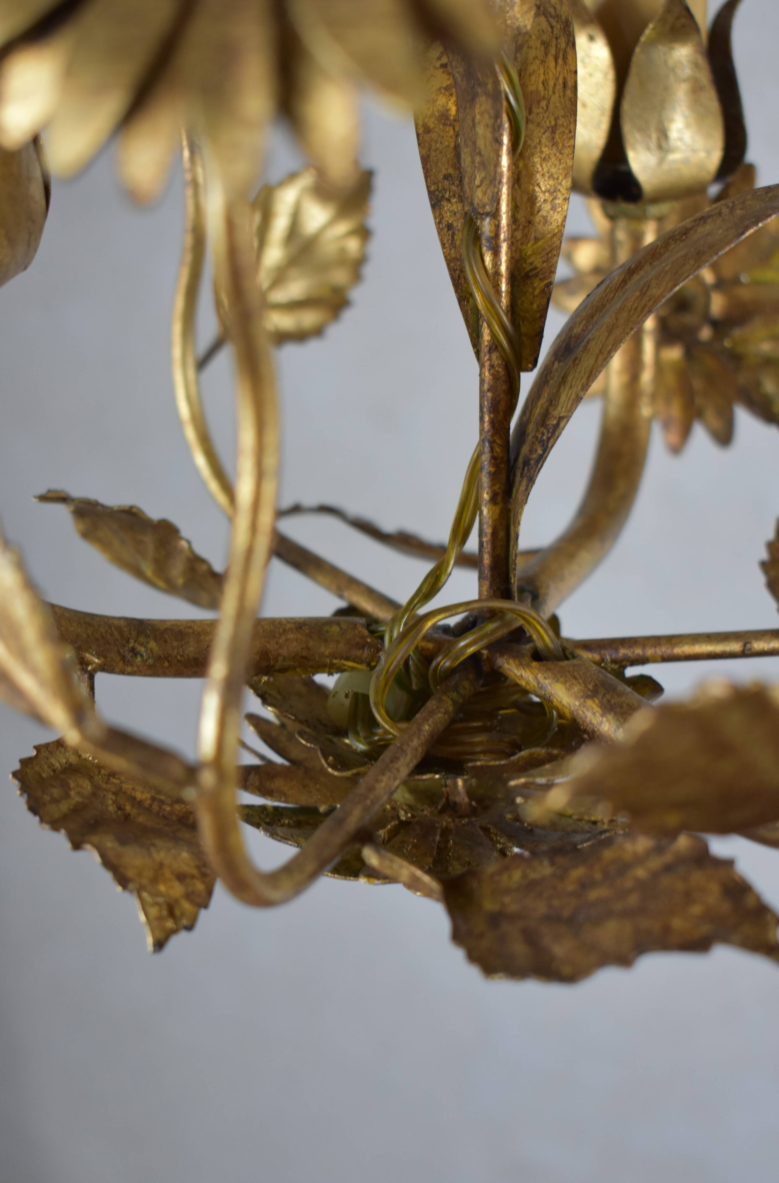 golden chandeliers with flowers.