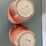 Pair of antique vases with butterfly and flower motif.