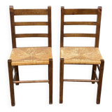 2 solid wood and straw chairs