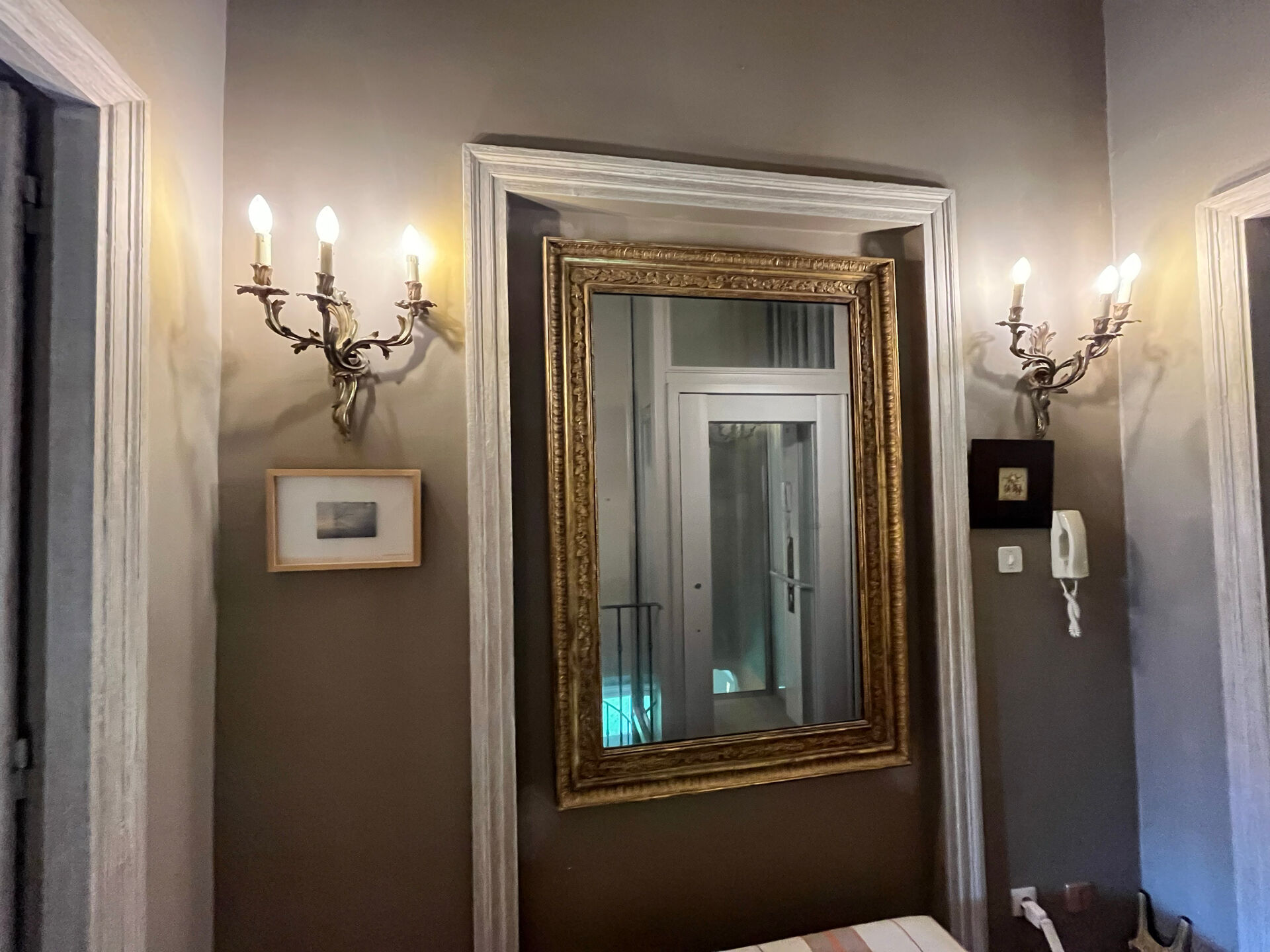 Pair of Louis XV style wall lights, rocaille with three branches in bronze.