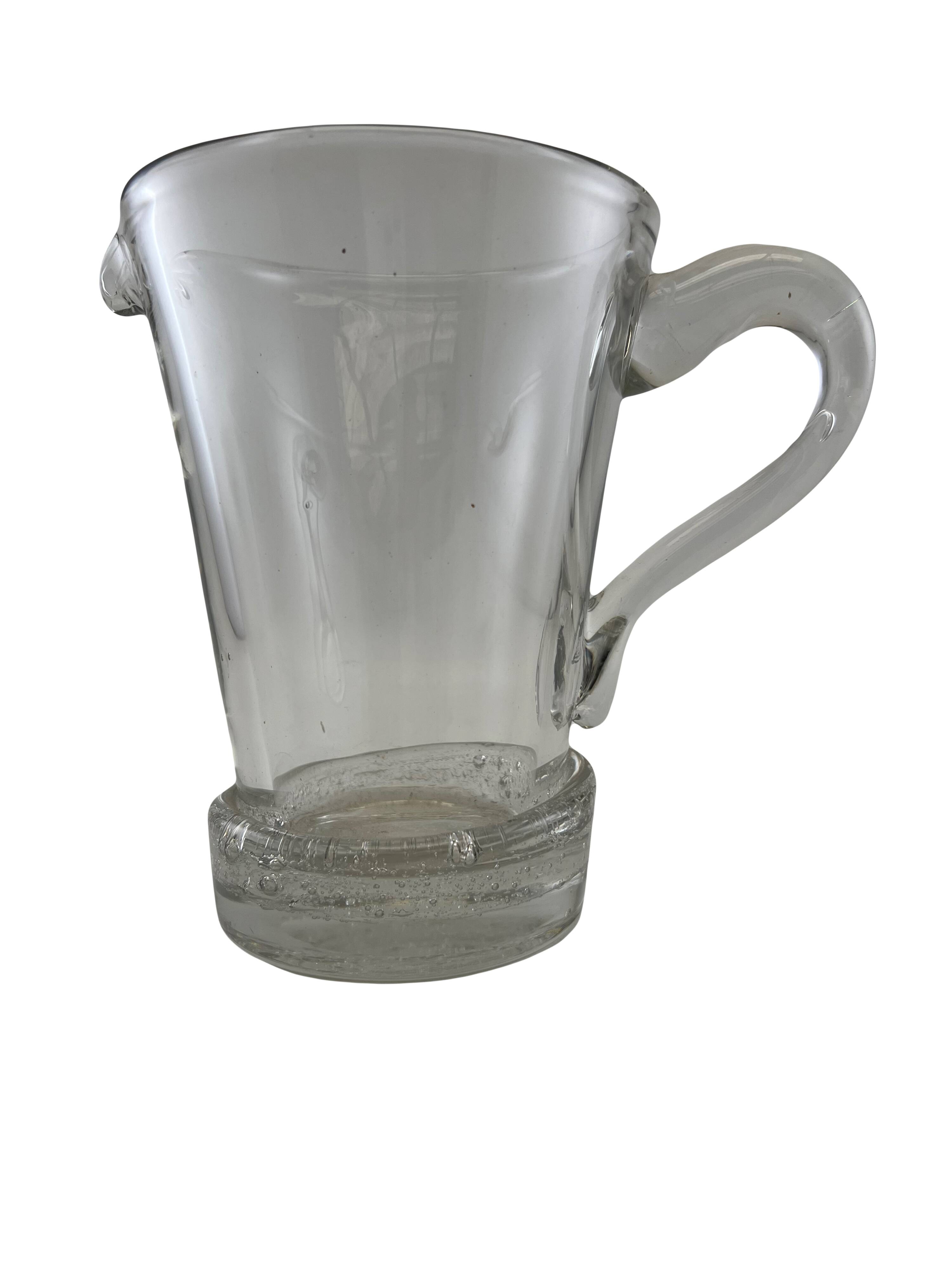 Large stylized glass pitcher