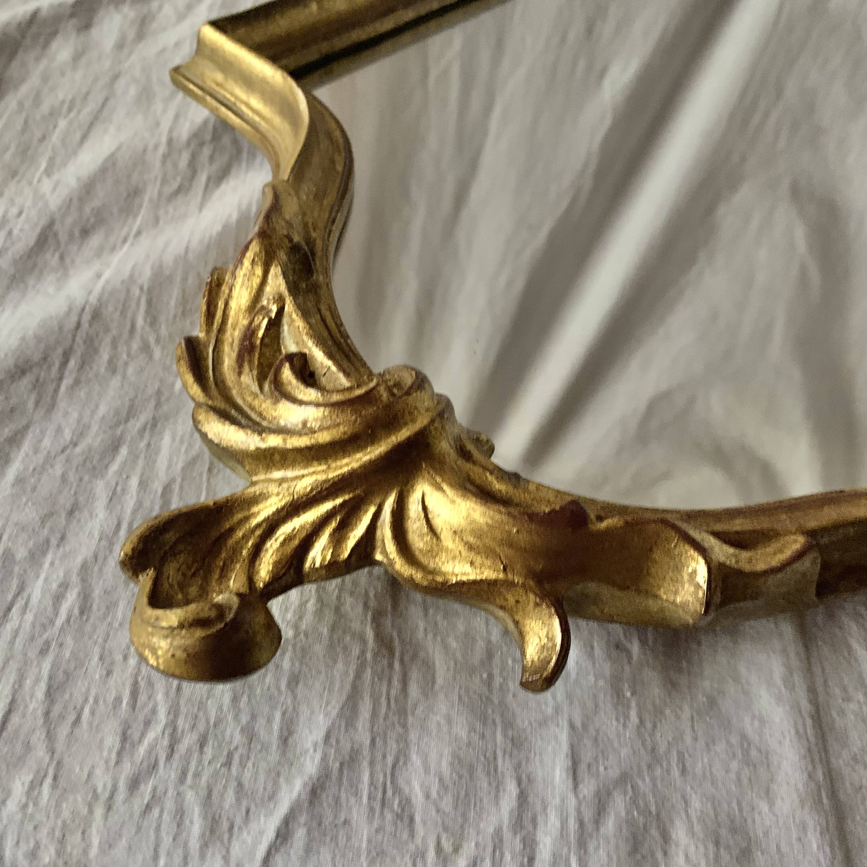 Antique Deknudt mirror in golden resin - 70 x 34 cm
