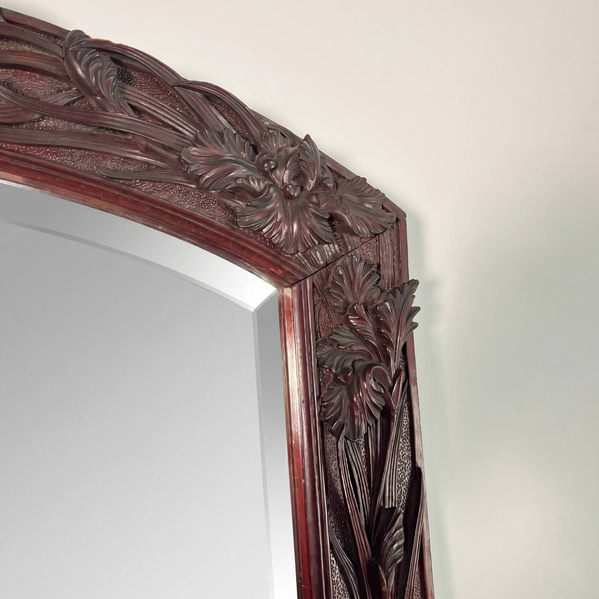 Large mirror (2 metres) Art Nouveau in carved mahogany with high-relief decoration.