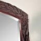 Large mirror (2 metres) Art Nouveau in carved mahogany with high-relief decoration.