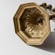 Vintage brass candlestick from the 1950s, seven-branched menorah with ornamental decoration.