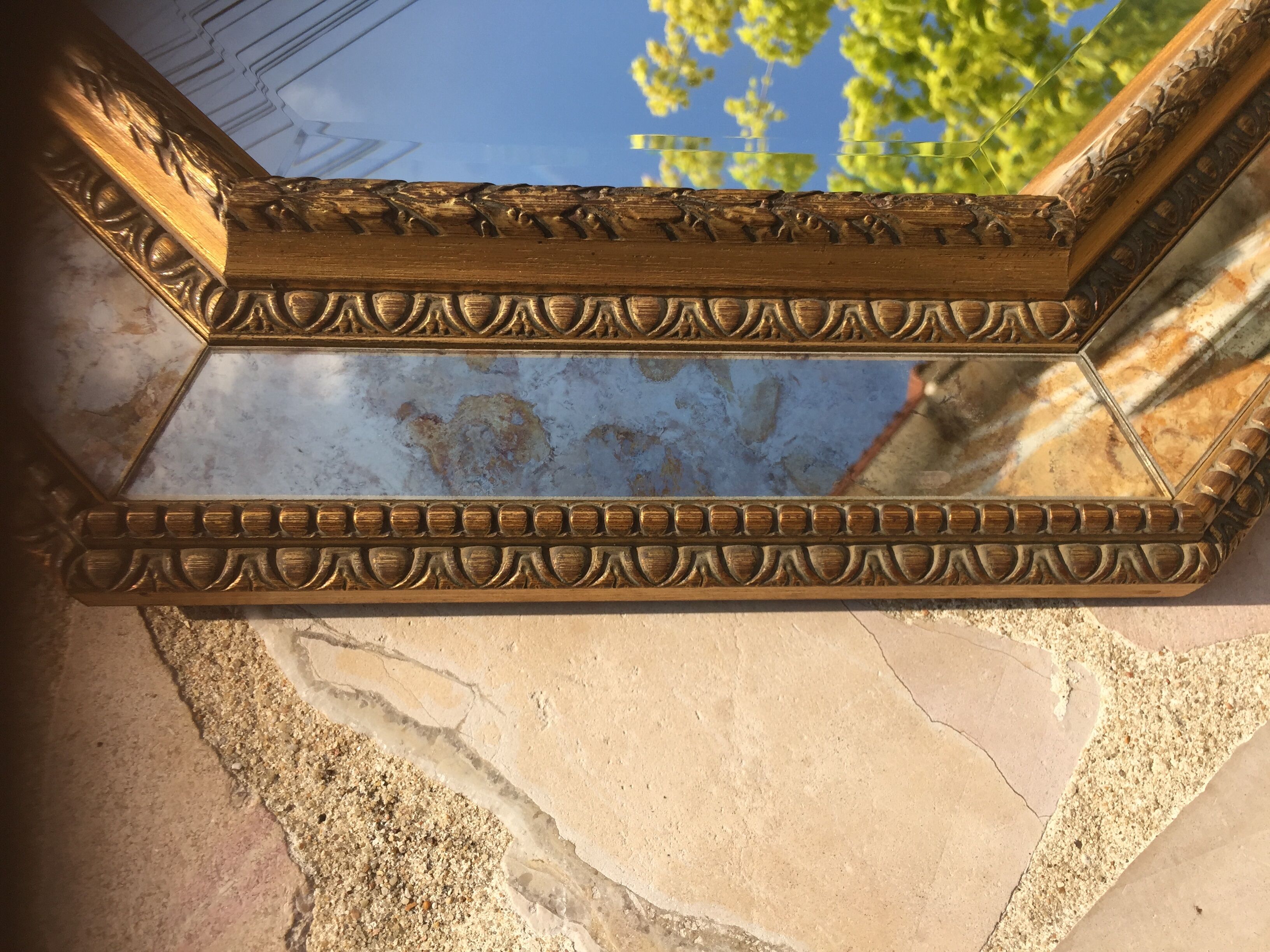 Antique mirror in gilded wood with beveled octagonal shape 72 x 63 cm