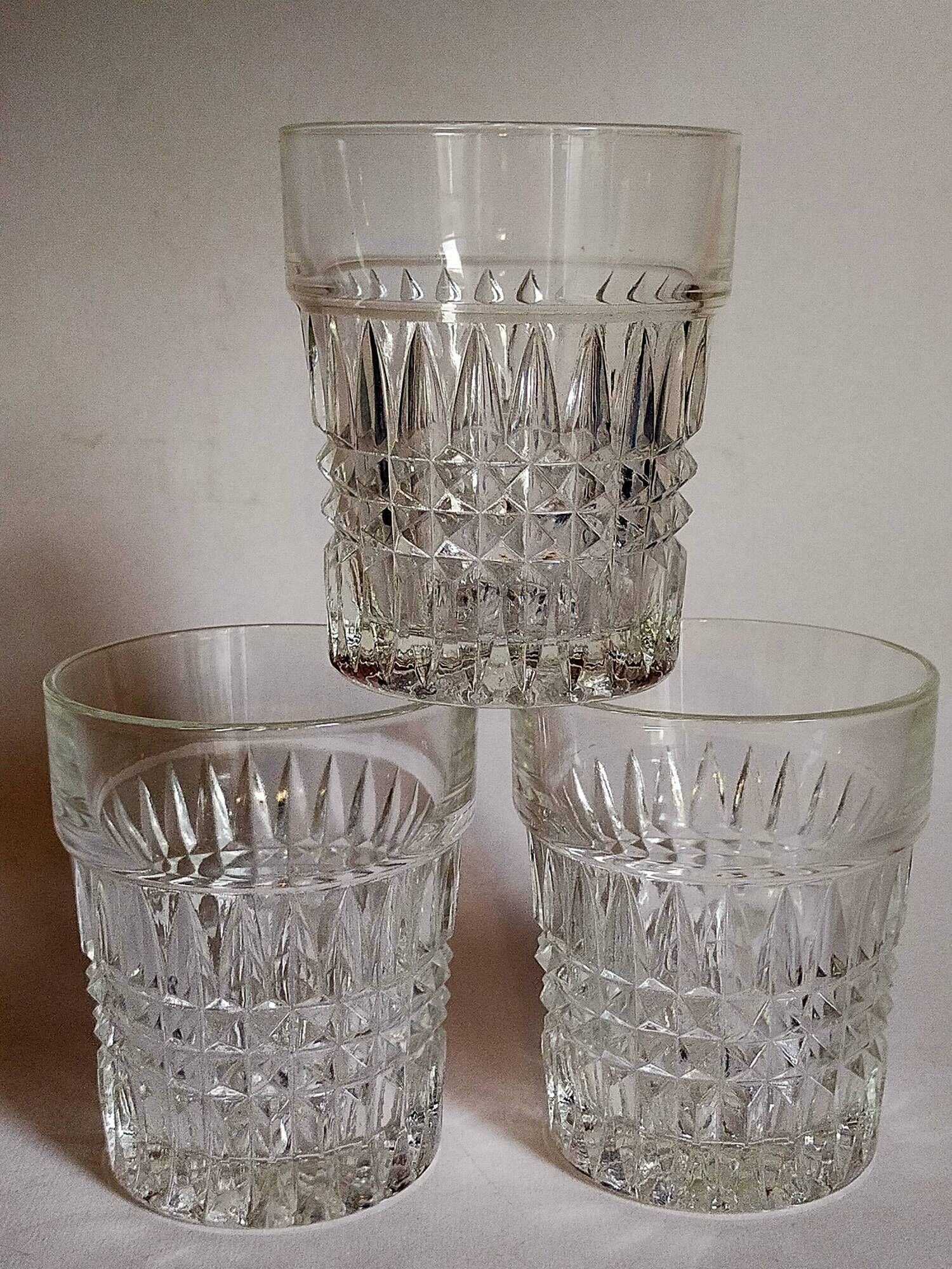 Trio of vintage whiskey glasses in pimpled glass