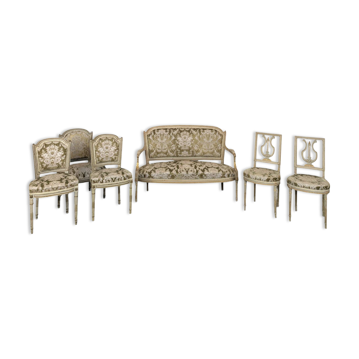 Cream lacquered Louis XVI style cabriolet salon with gold highlights.