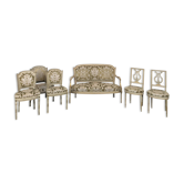 Cream lacquered Louis XVI style cabriolet salon with gold highlights.