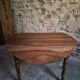 Antique drop-leaf dining table in walnut, France, circa 1900.