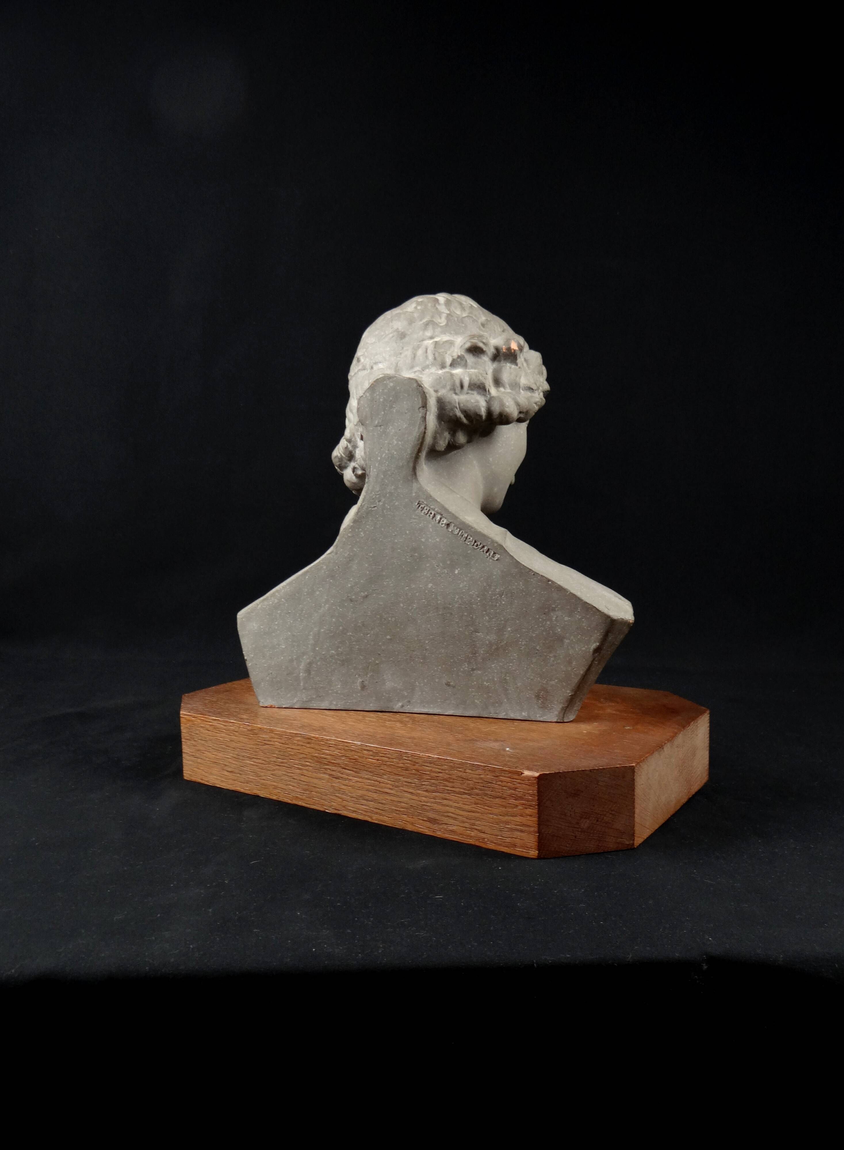 Terracotta bust of the smiling angel from Reims Cathedral with base