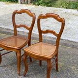 2 Louis Philippe caned chairs from the 19th century in solid wood.