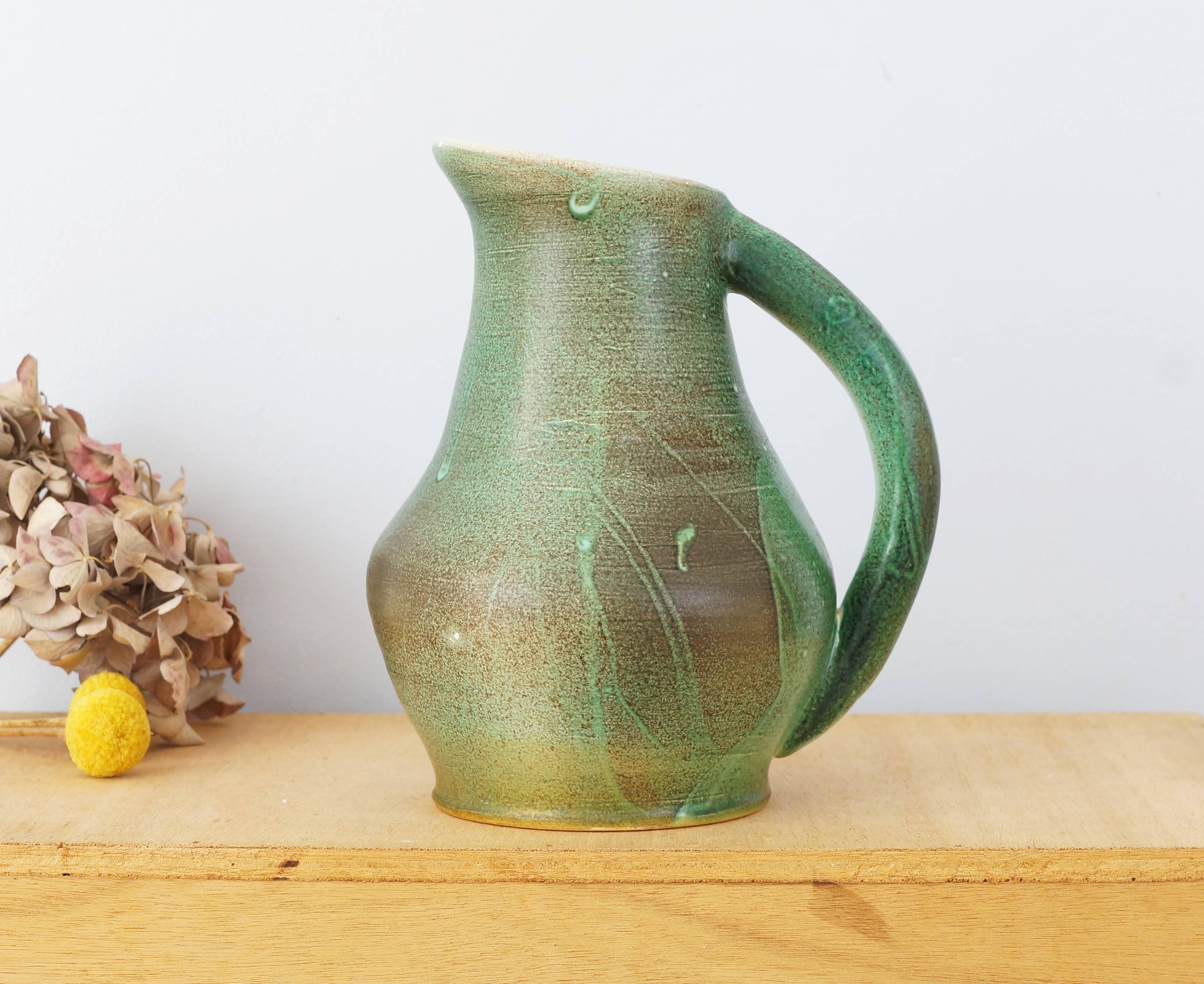 Ceramic jug enamelled in shades of green, signed, vintage