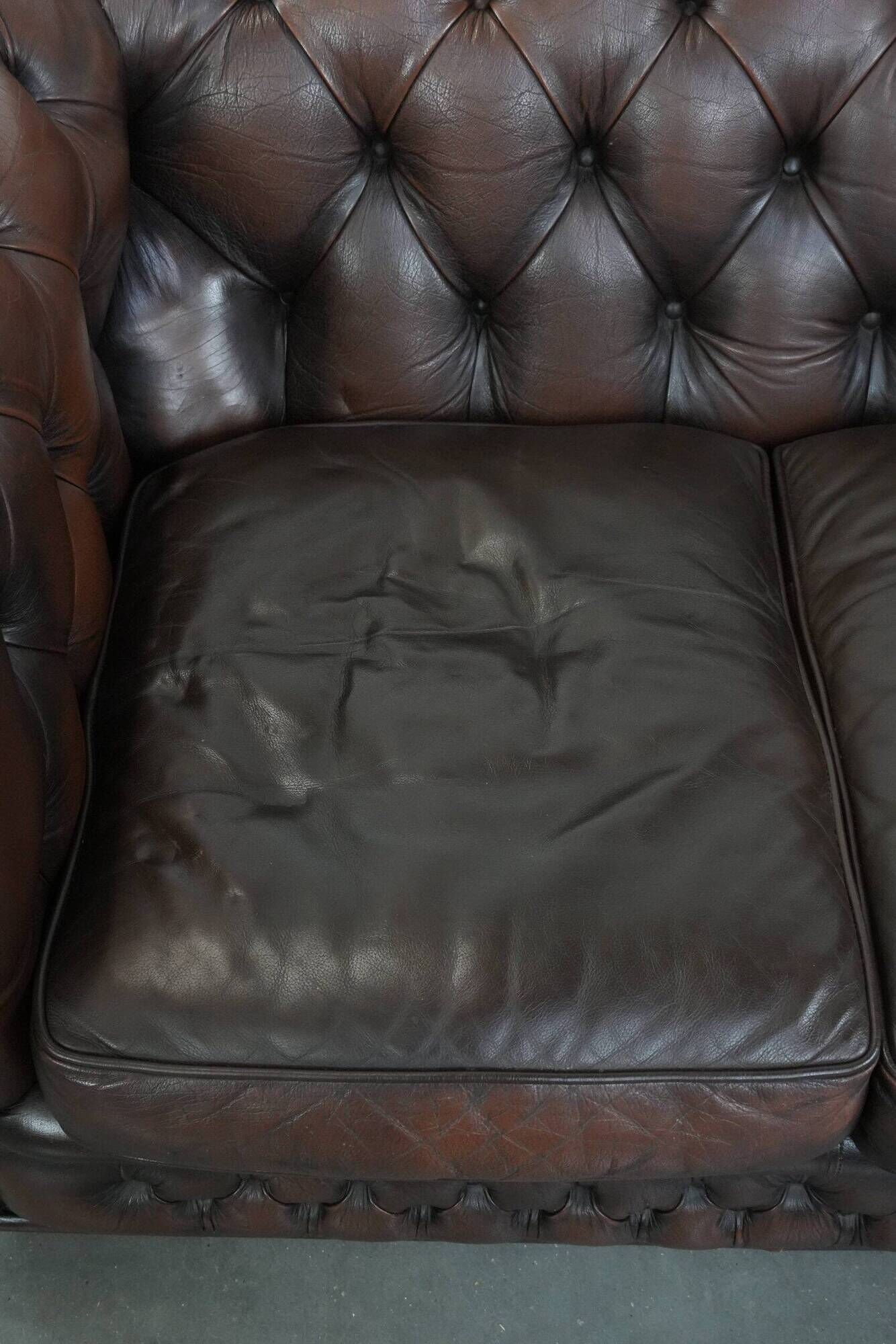 Dark brown cow leather vintage 2-seater Chesterfield sofa in English style