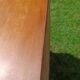 Rattan and wood splayed-leg chest of drawers