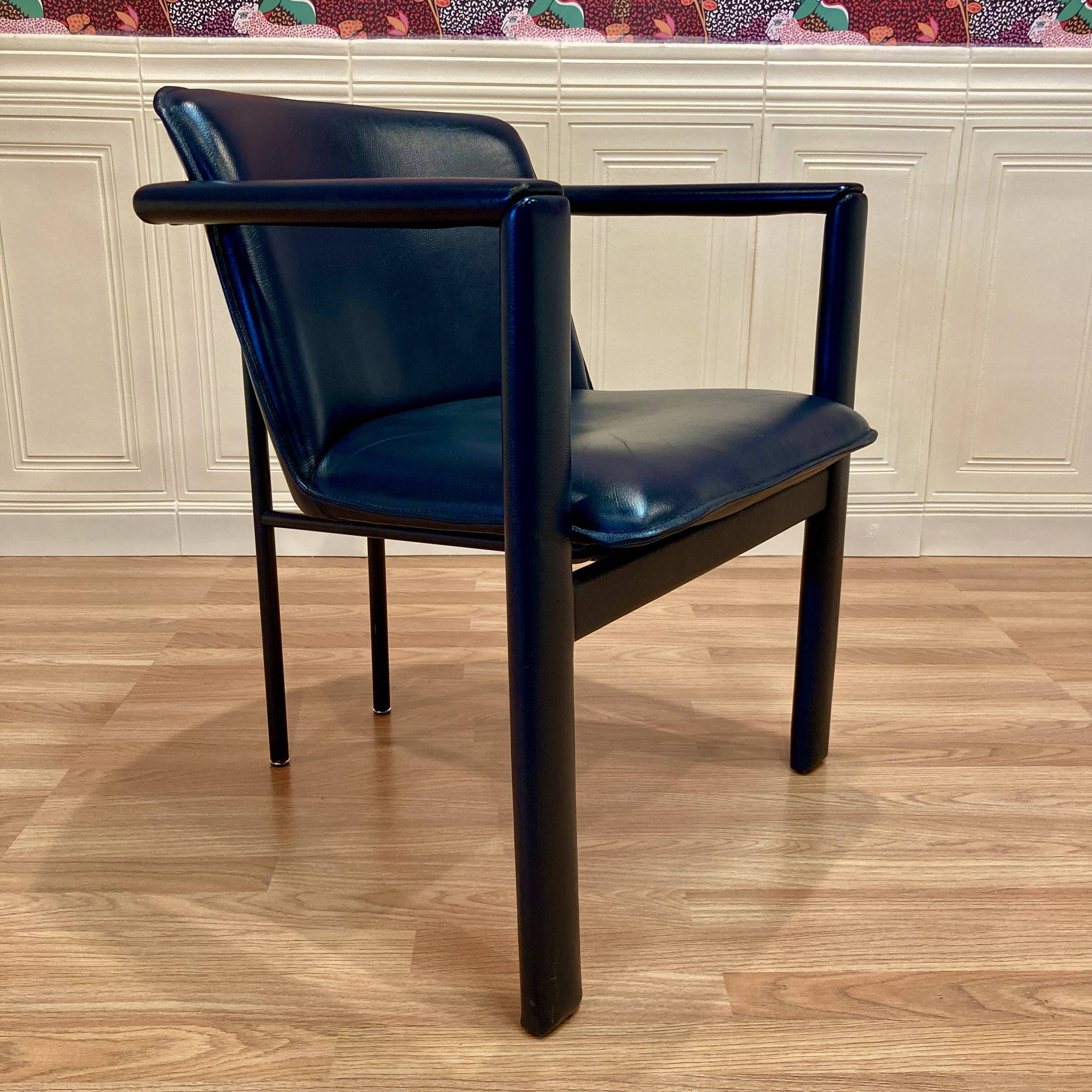 Set of 3 designer leather and metal armchairs.