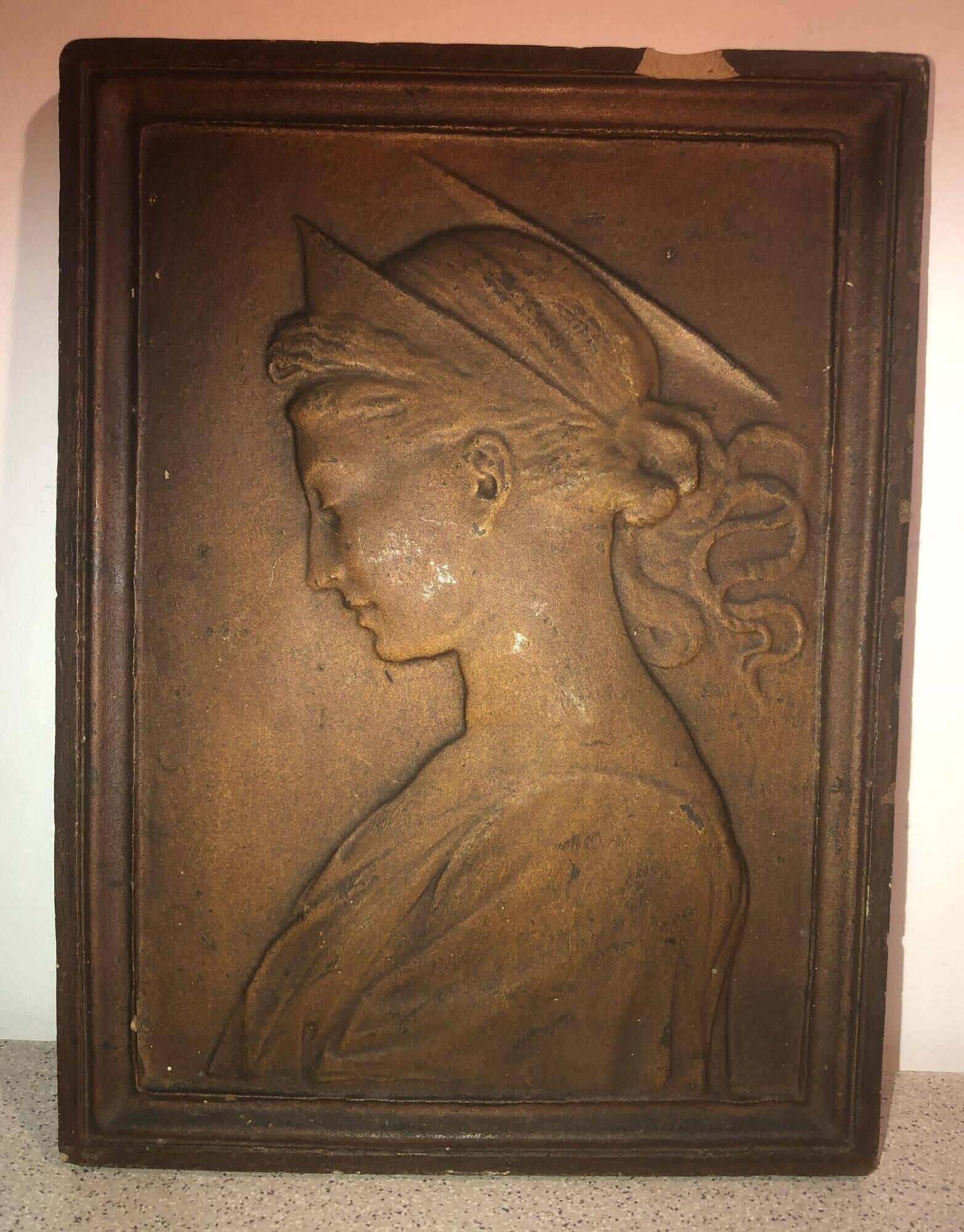 Patinated limestone bas-relief profile of a young woman