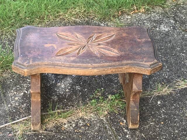 Bench in carved and varnished wood, mountain chalet decoration, old