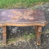 Bench in carved and varnished wood, mountain chalet decoration, old