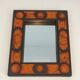 Ceramic mirror in shades of orange