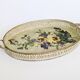Oval metal decorative vintage tray with floral pattern.