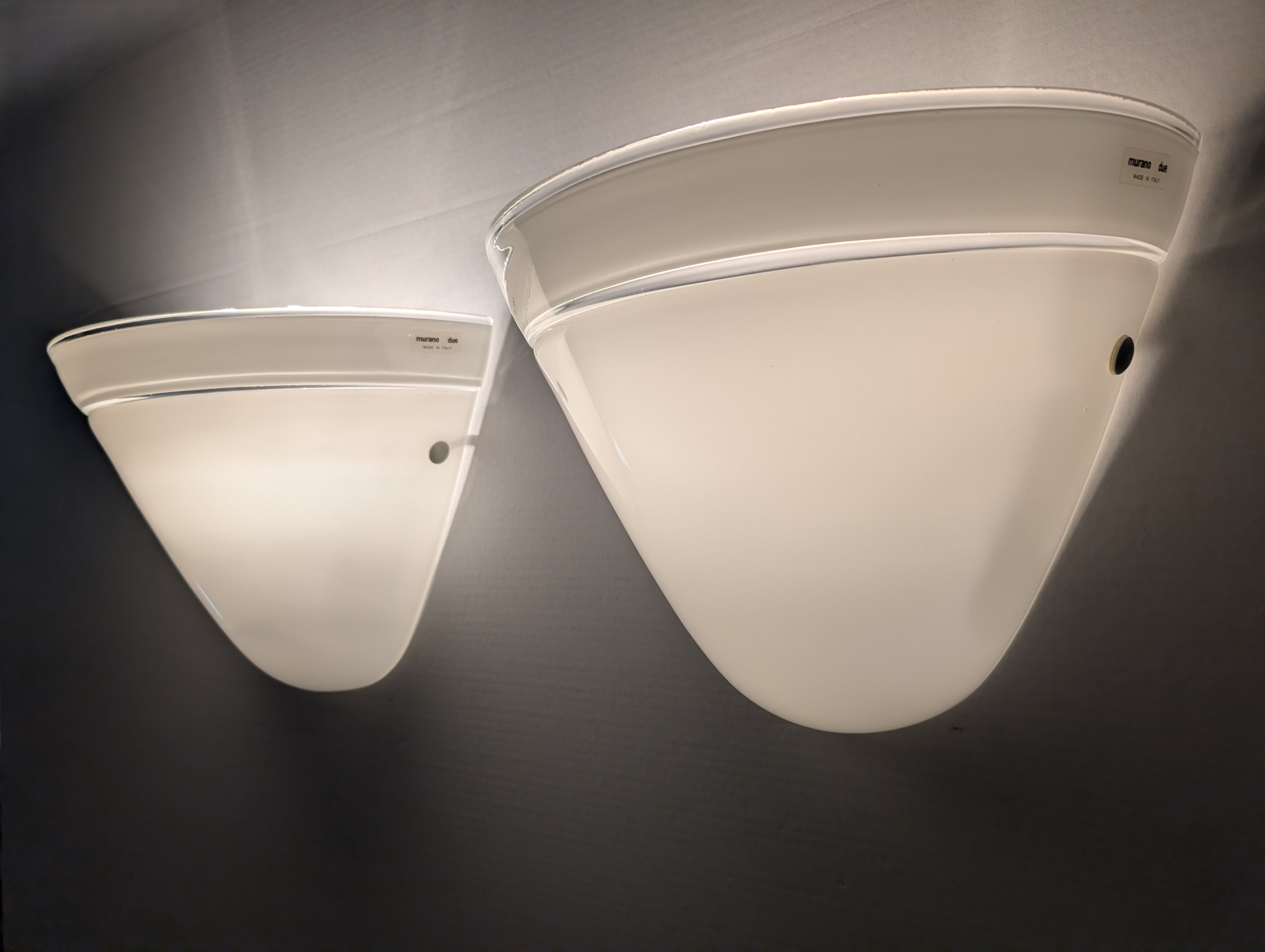Pair of Murano Due white crystal wall lights, Italy, 1980s