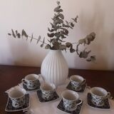 Black and white cups with plates