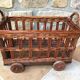 Small wicker wheeled cart