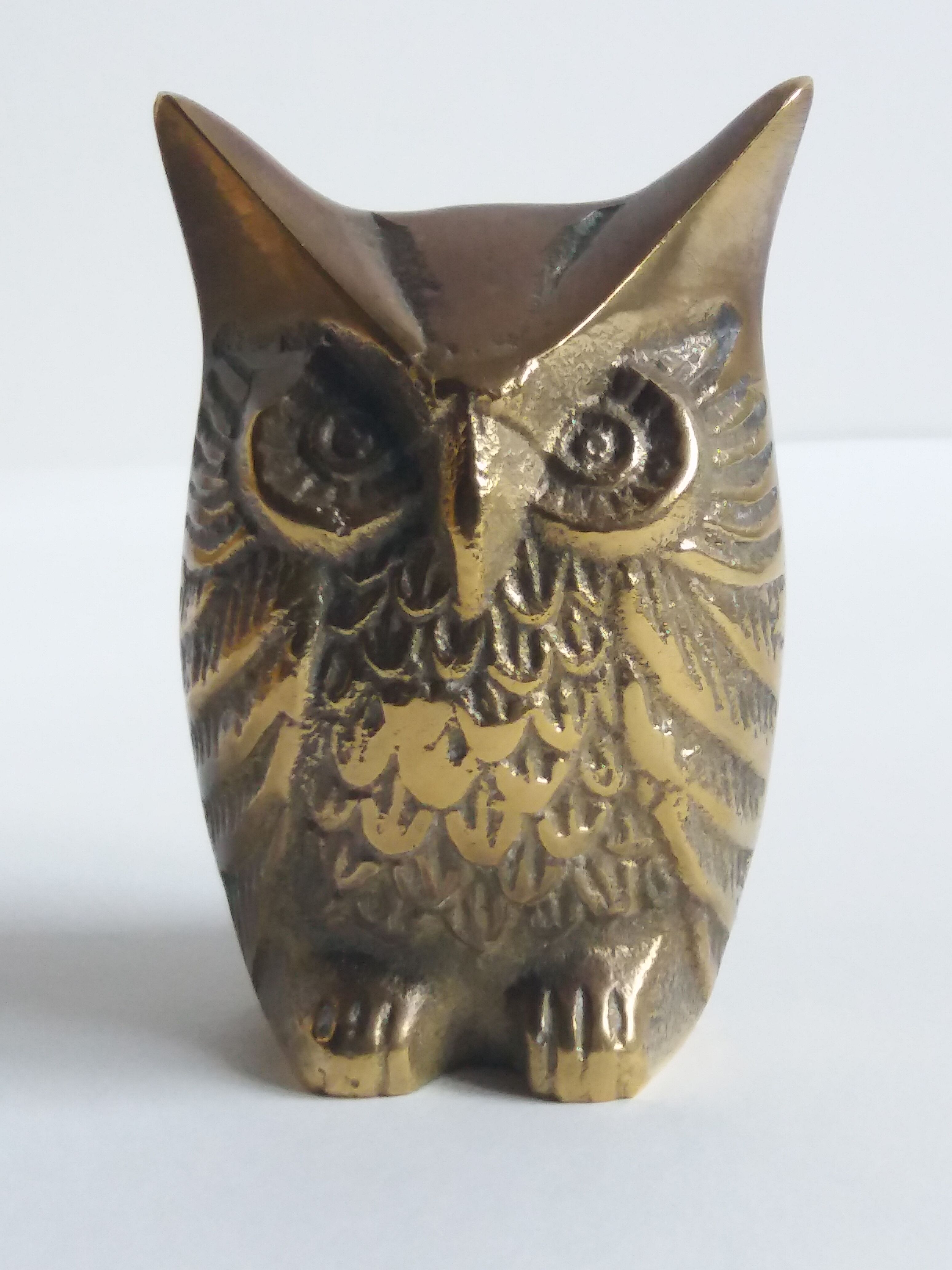 Chiseled brass owl