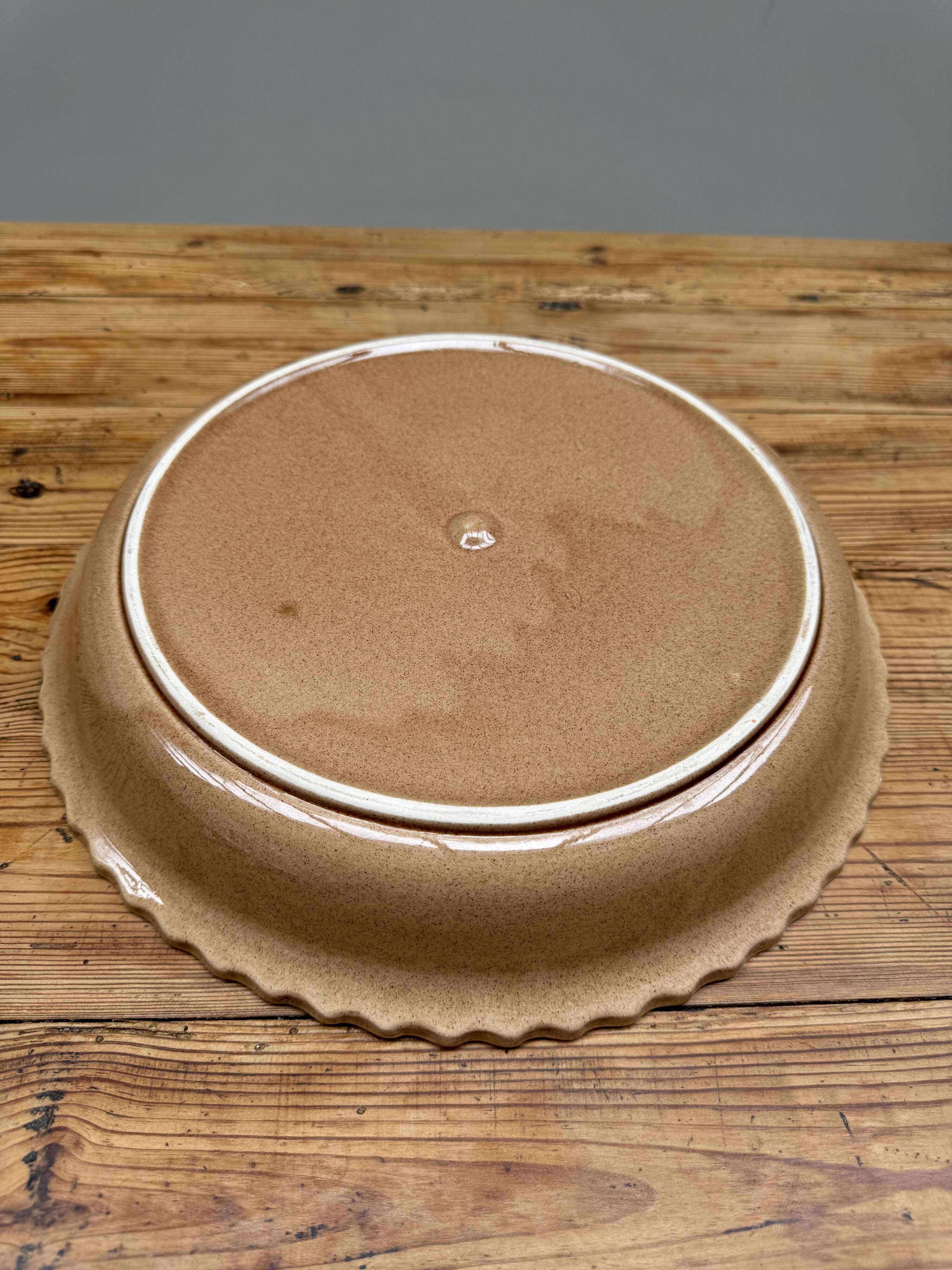 A trompe l’oeil strawberry pie dish