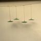 Vintage industrial enameled sheet metal pendant lights with golden wires, old green and white lampshade