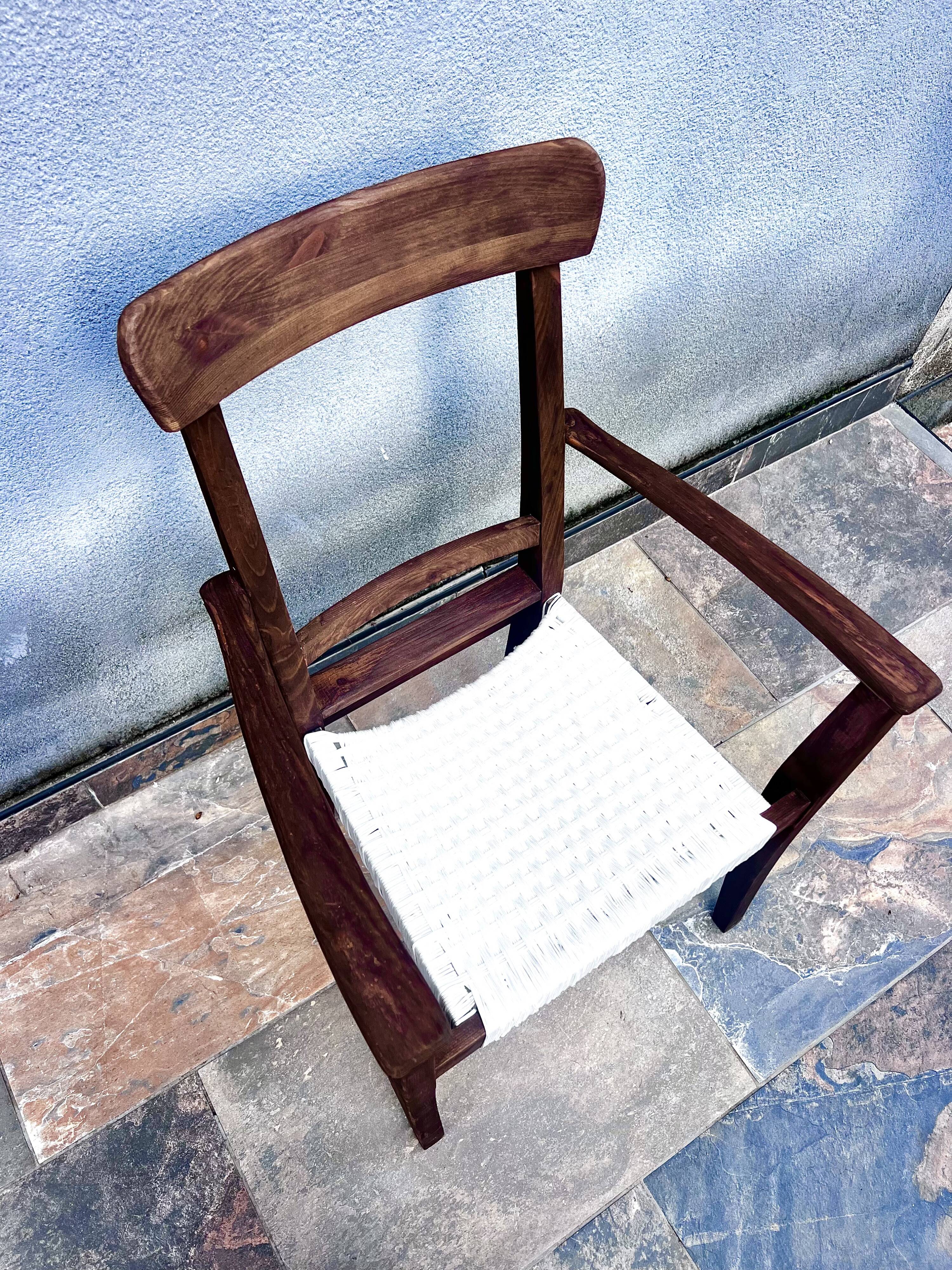 Scandinavian chair in wood and woven natural fibre.