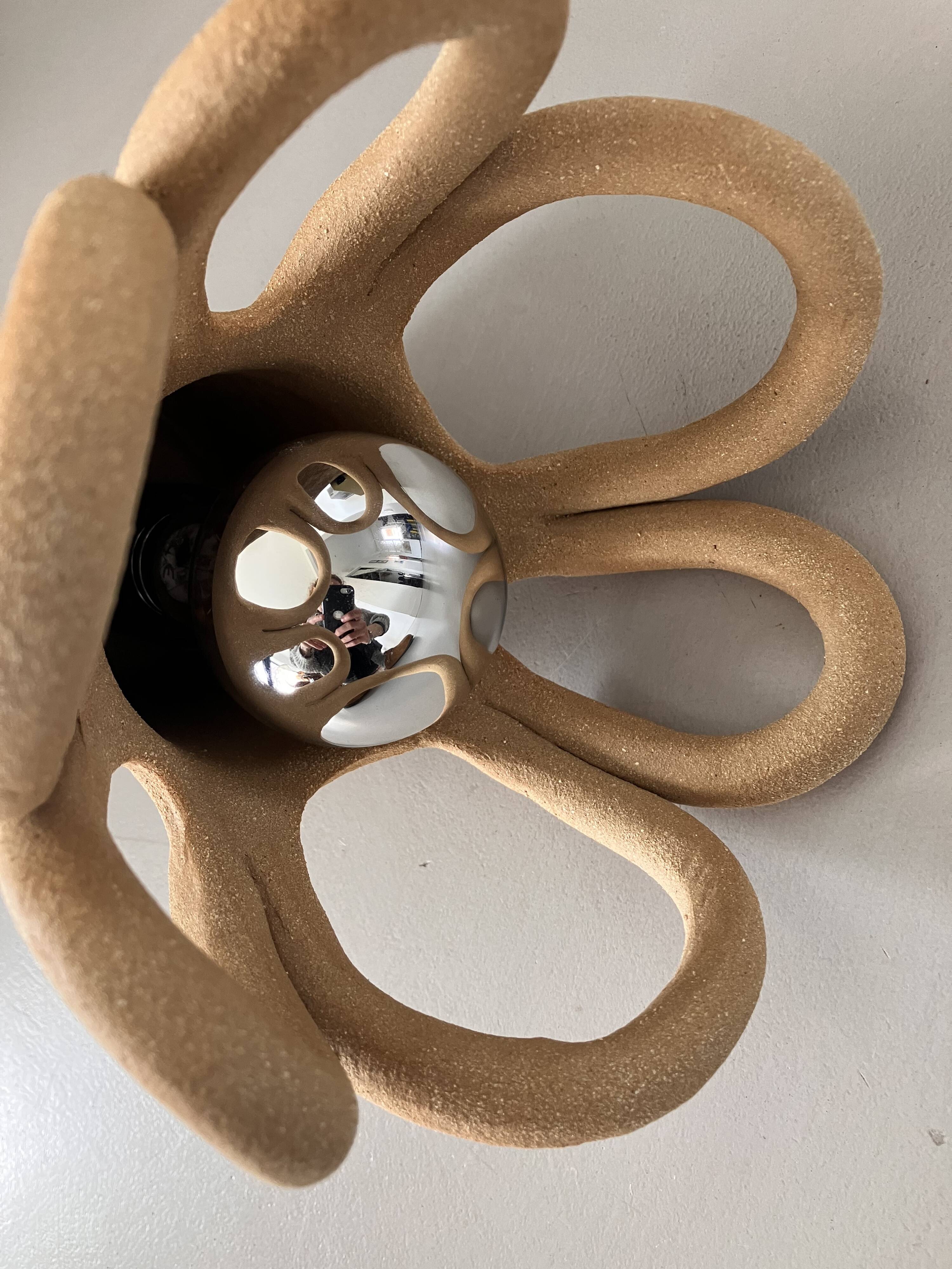 Suspension in the shape of a flower made of handcrafted ceramic, raw red stoneware mid-century.