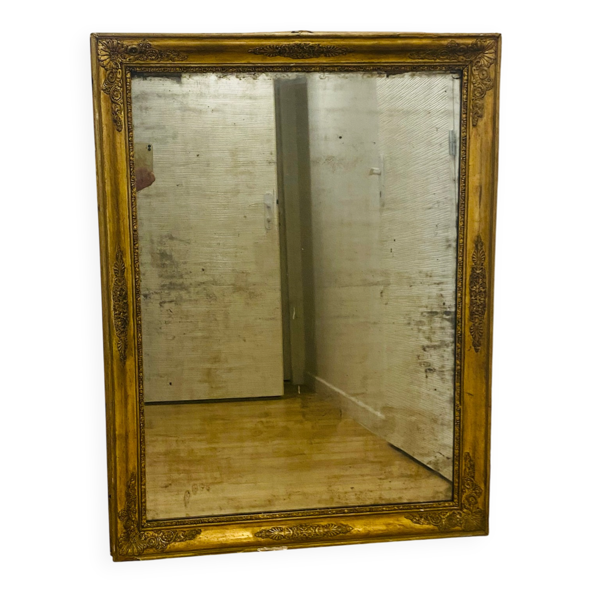 Antique mercury mirror with an Empire gold frame.