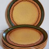 Six vintage stoneware plates with green net