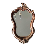 Pretty Baroque style mirror / Louis XV patinated with pink / golden copper reflections. Volutes, leafy shells