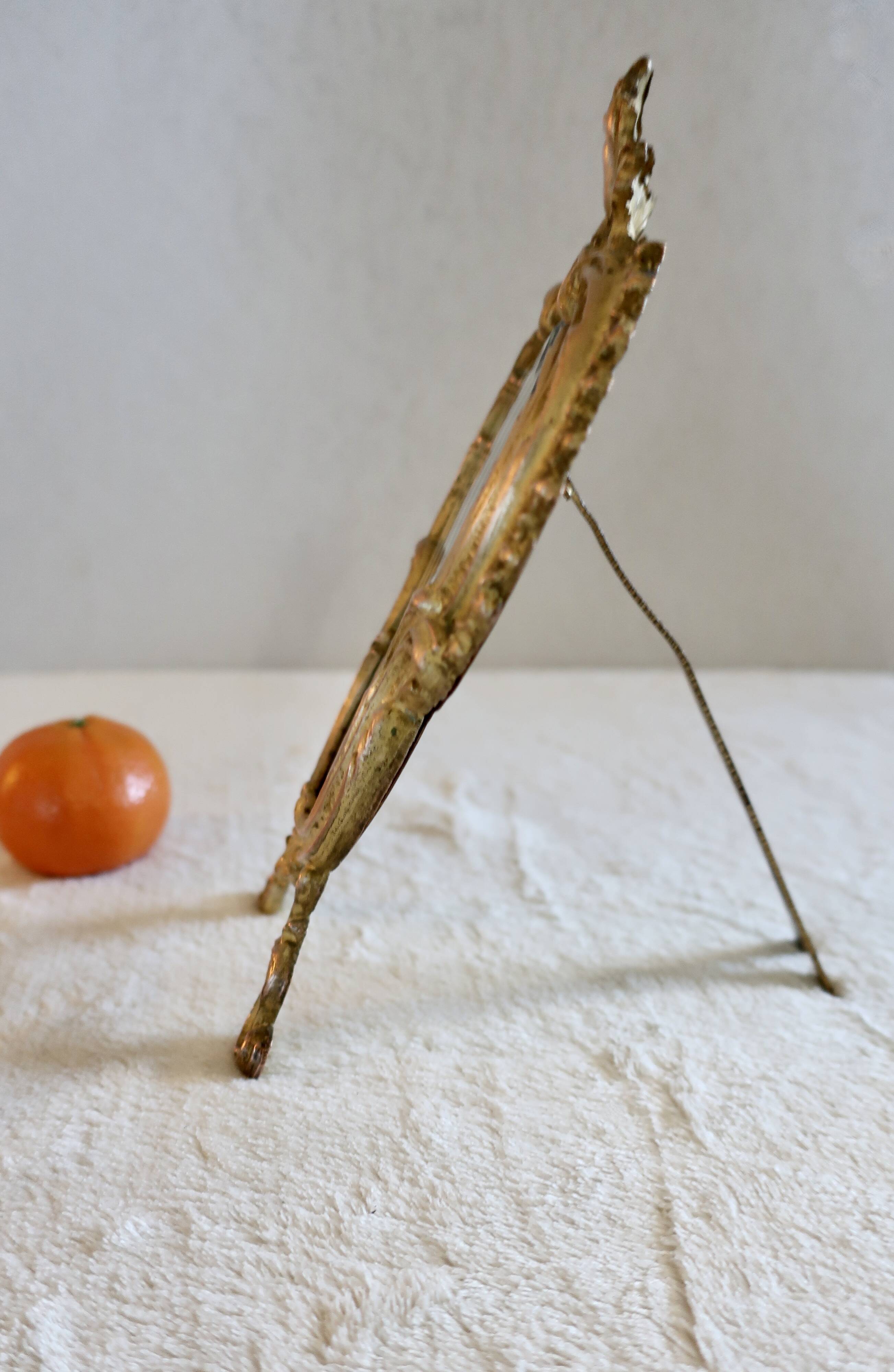 Small vintage 19th century mirror or hand mirror, bronze, beveled glass, baroque, rococo style.