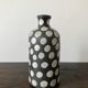 Terracotta vase painted with polka dots