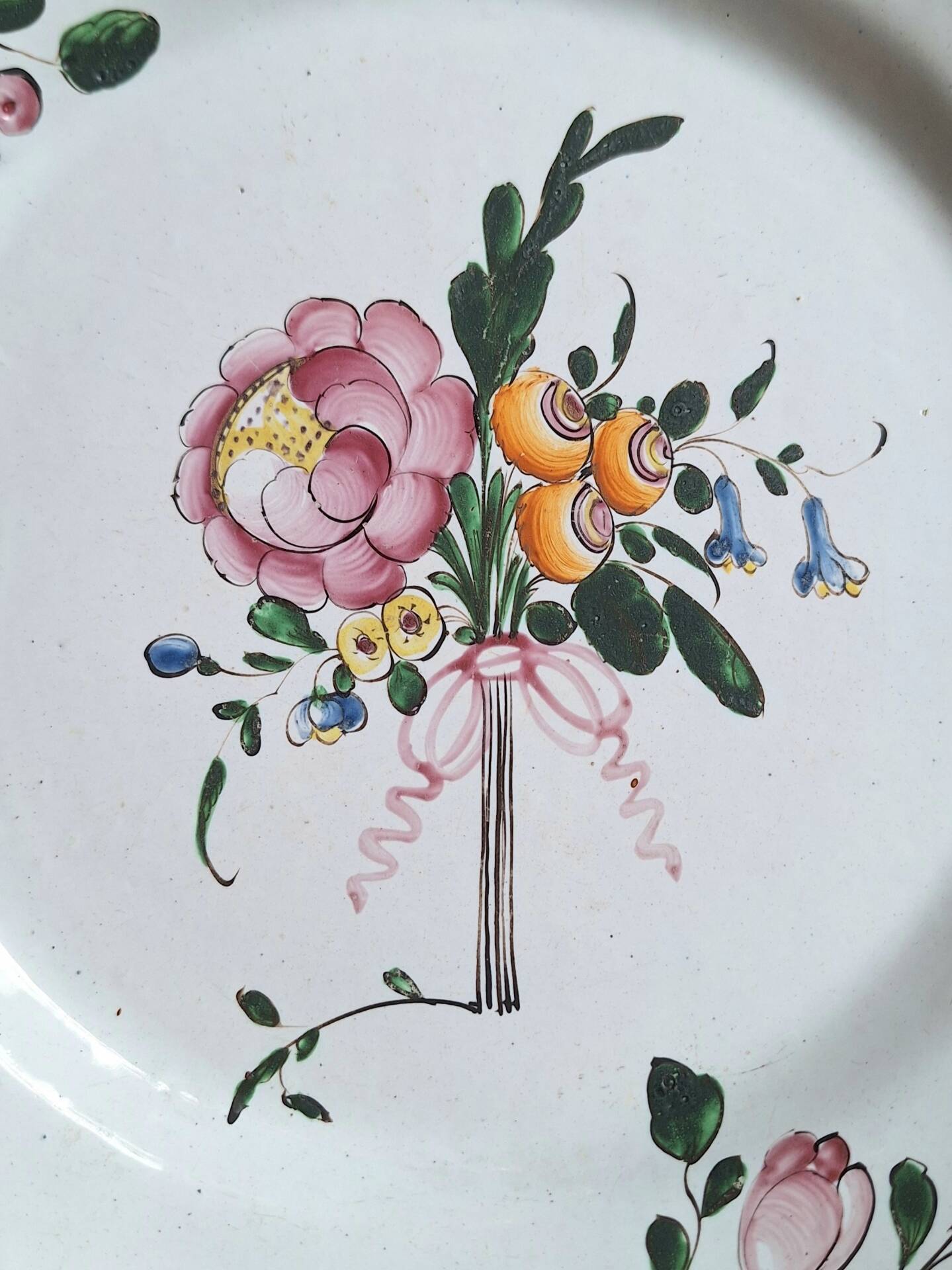 Hand-painted earthenware plate from eastern France, 18th century.