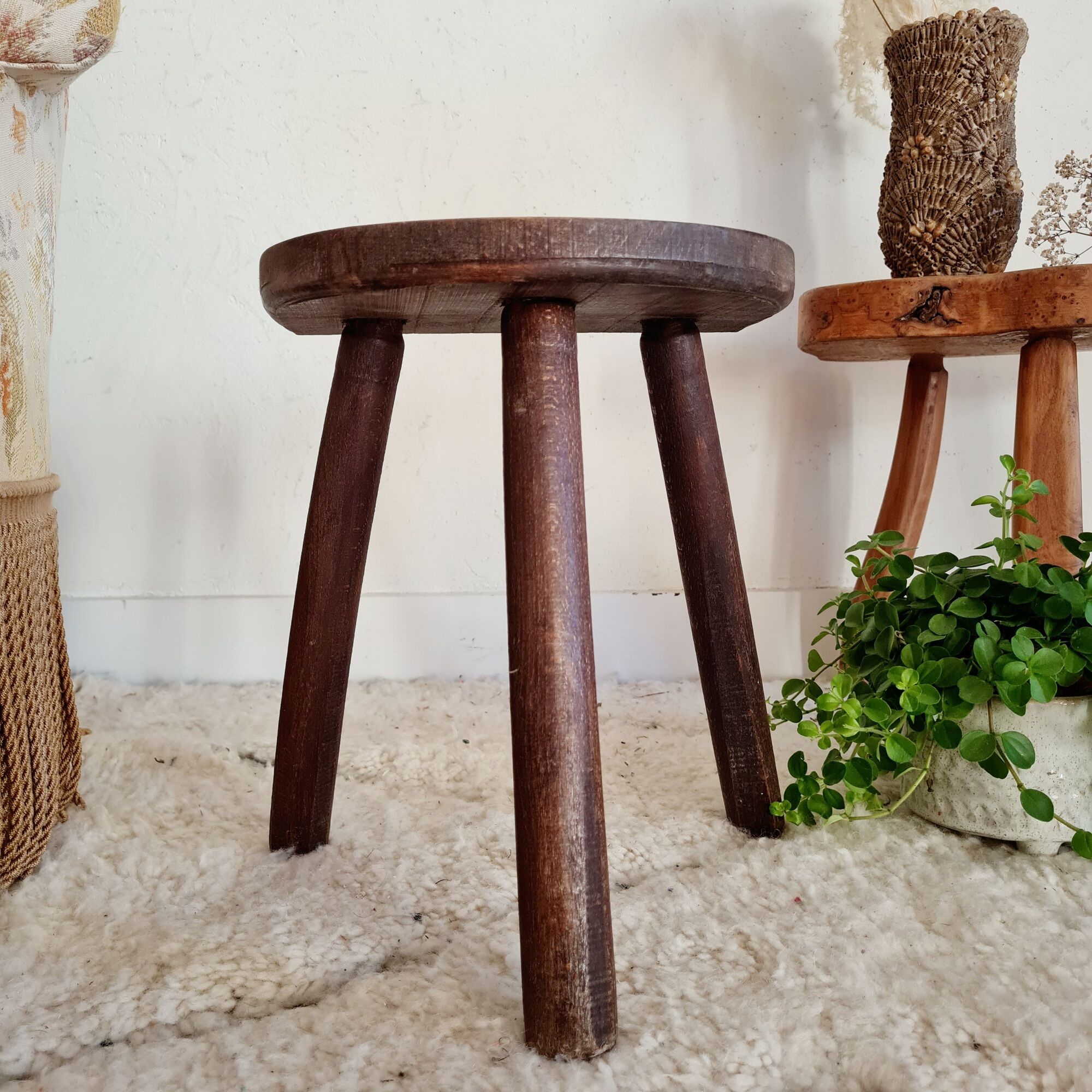 Old wooden tripod wooden farm stool made of wood