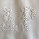 pair of AP monogram towels in cold linen