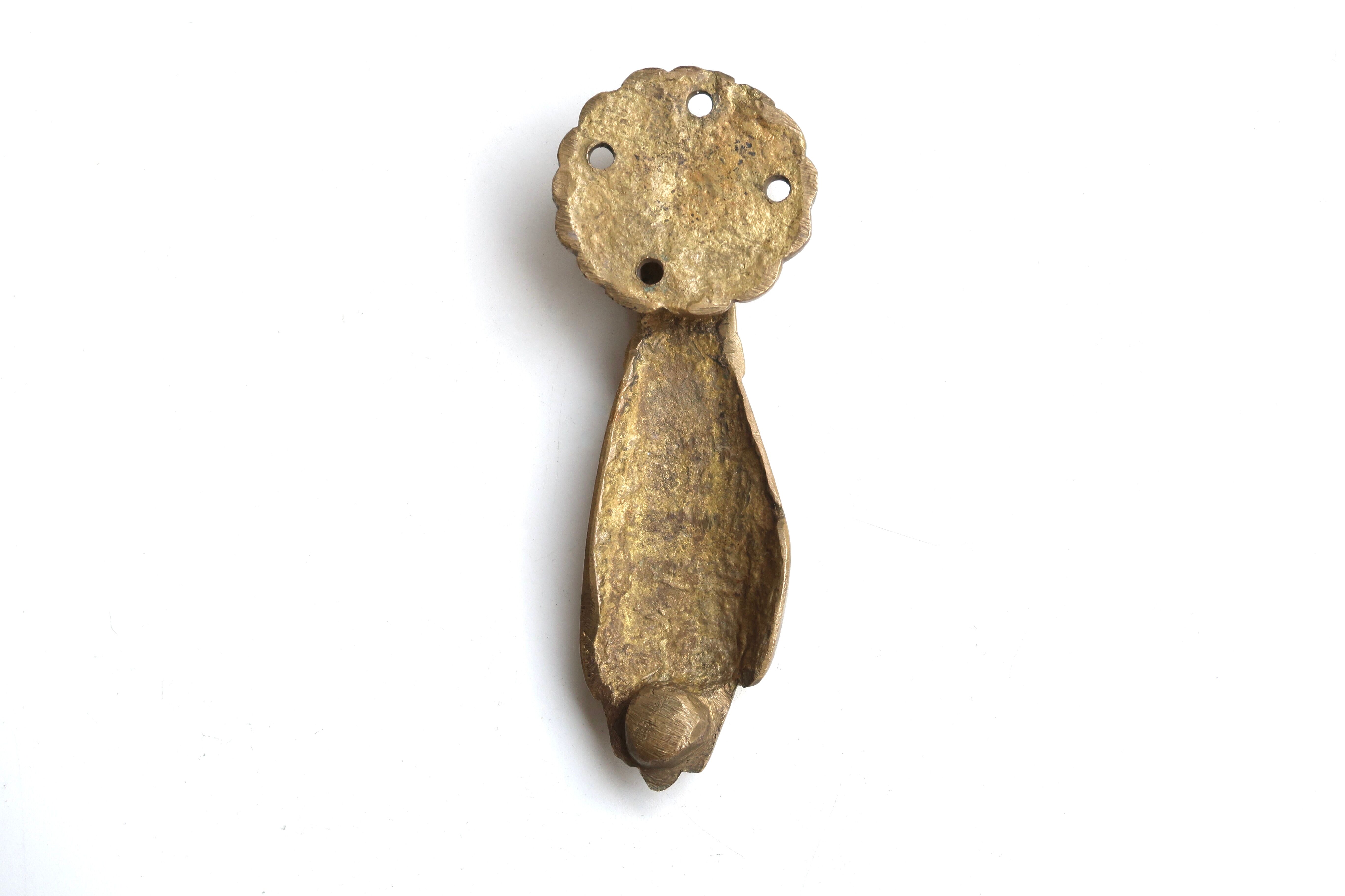 Hand-shaped brass door knocker, 70s