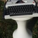 Revised typewriter and Olympia Traveller luxury with his satchel