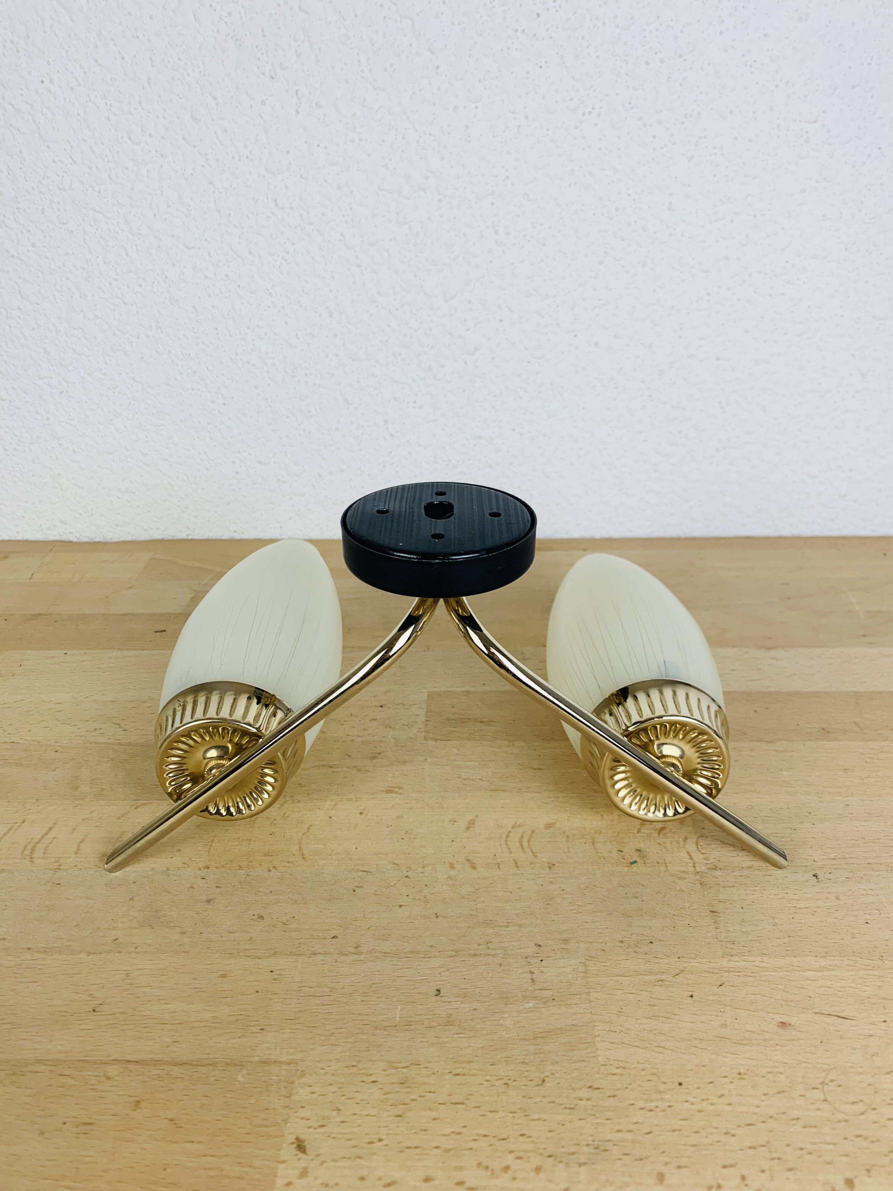 50s double-light wall light, brass and black metal, opaline tulips