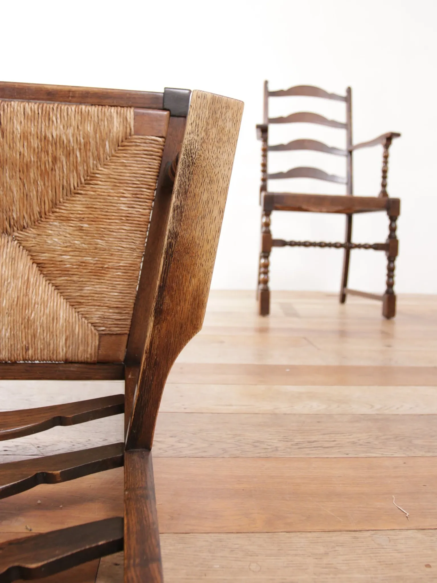 Pair of English oak armchairs with ladder back and rush seats